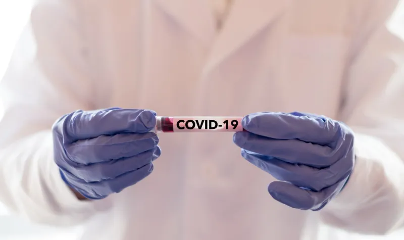 covid-19 named by who for novel coronavirus ncp concept doctor or lab technician holding blood sample with novel (new) coronavirus ncp in wuhan, hubei province, china, medical and healthcare