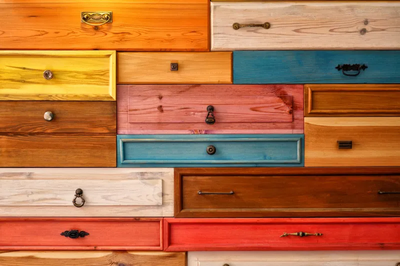 colorful wooden drawer, abstract decorative design on wall