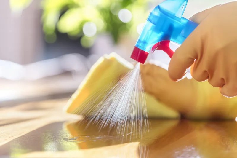 cleaning with spray detergent, rubber gloves and dish cloth on work surface concept for hygiene