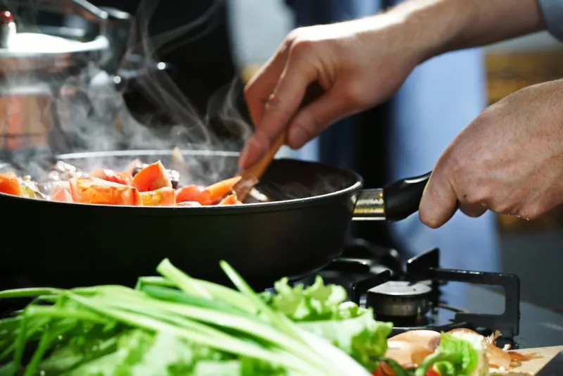 chef prepares hotpot in the stew pan in the kitchen