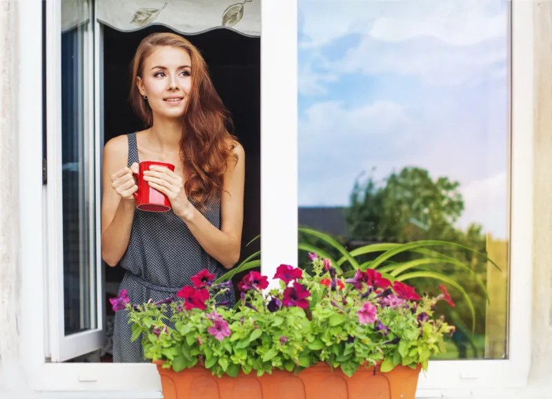 beautiful young womanenjoing morning with cup of coffee