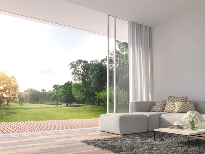 modern living room 3d renderthe rooms have wooden floors ,decorate with white fabric sofa,there are large open sliding doors, overlooks wooden terrace and big garden