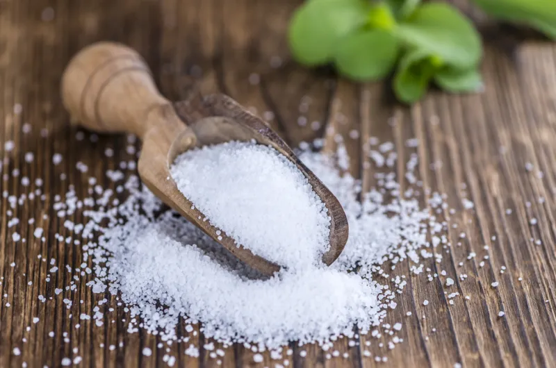 stevia (as granular) on an old wooden table (selective focus, selective focus)