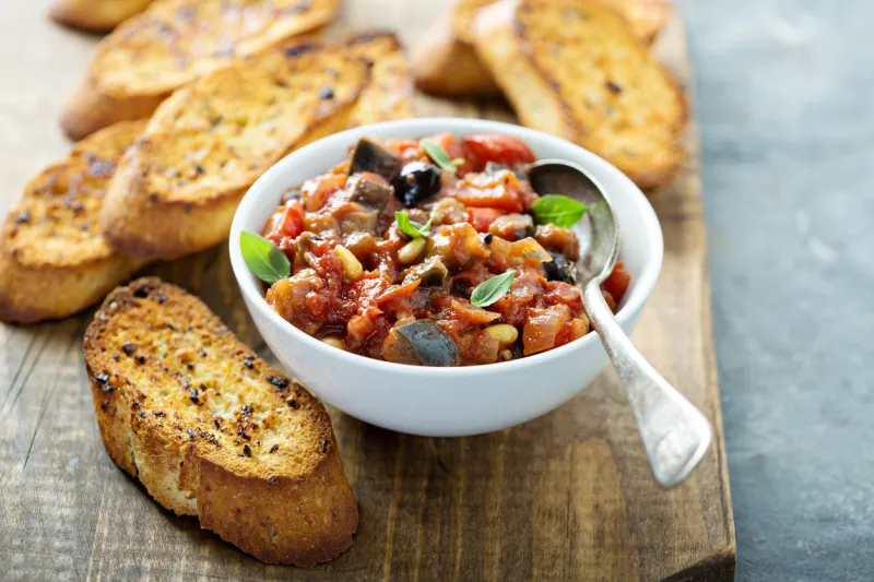 eggplant caponata crostini or bruschetta on garlic bread