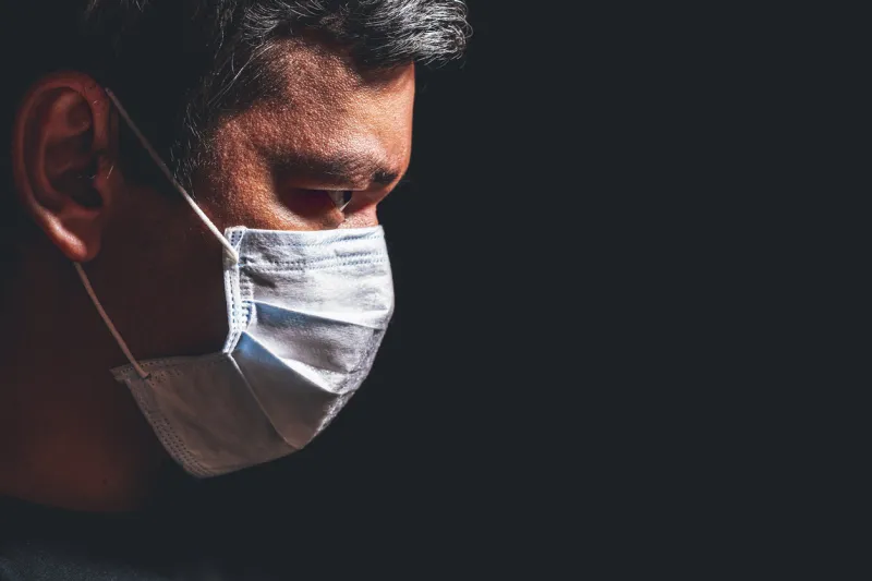 profile of man in mask, concept of viral infection theme of corona-virus epidemic