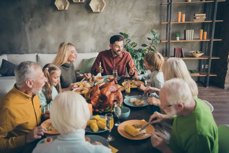 portrait of nice charming cheerful big full family company group brother sister talking meeting gathering eating domestic meal dishes brunch gratefulness modern loft industrial style interior house