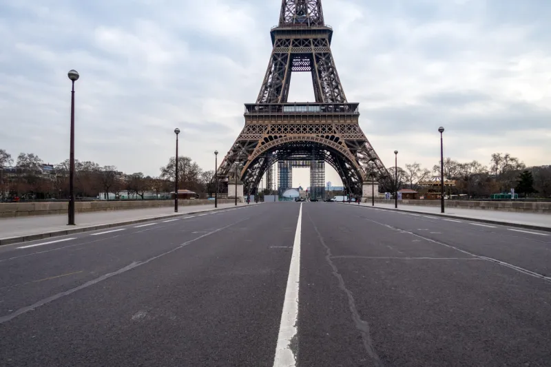 empty iena bridge in front of eiffel tower during coronavirus lockdown in paris