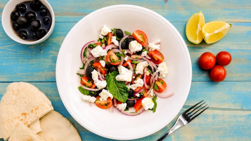 greek style mediterranean feta cheese and fresh salad with tomatoes and black olives