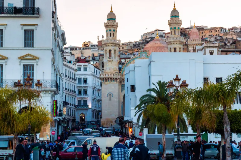 people on martyrs' square and ketchaoua mosque and walking , in the capital of algeria