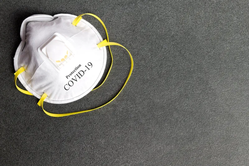 protection mask from coronavirus covid-19 protective mask on a stone background personal protection equipment against viruses awareness