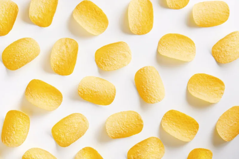 potato chips pattern on a white background top view