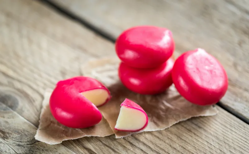 stack of mini cheese on the wooden table
