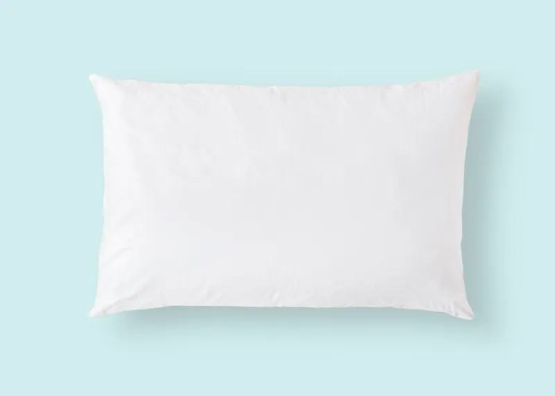 white pillow on blue background isolated with clipping path for bedding mockup design template
