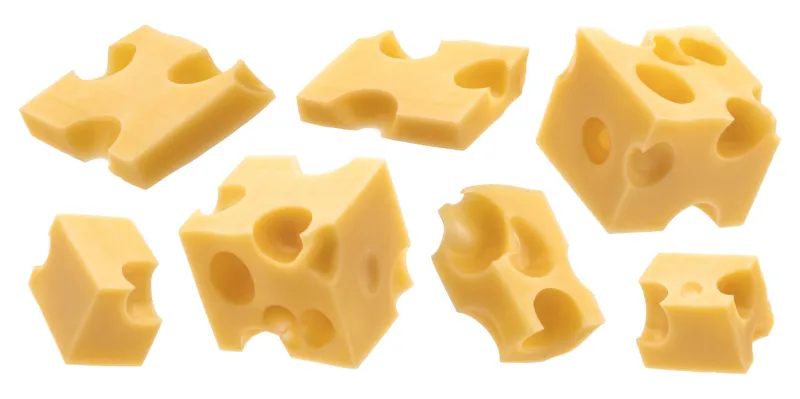 set of cheese cubes, pieces of swiss emmental isolated on white background with clipping path