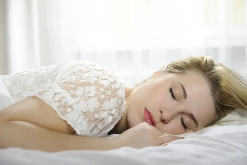 woman sleeping in bed woman sleeping isolated on white background