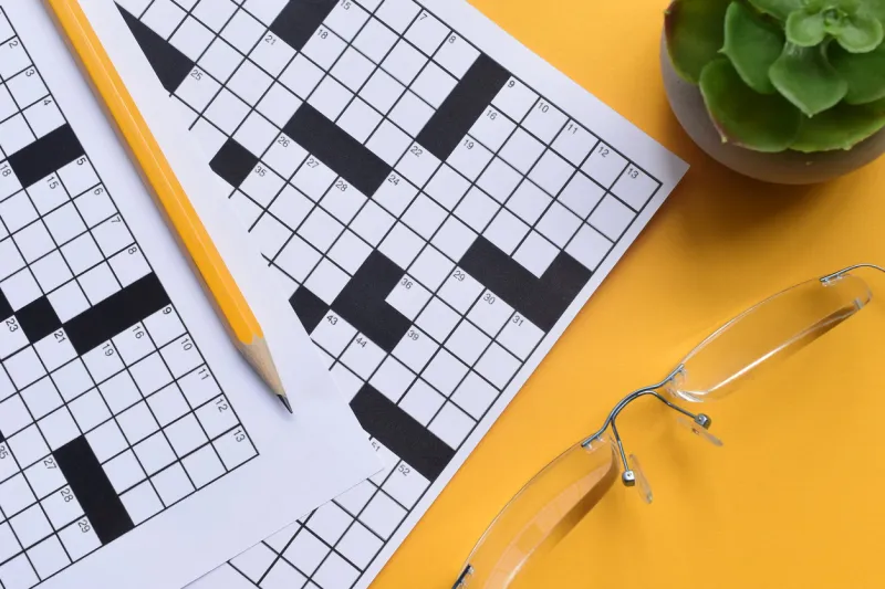 crossword puzzles and yellow pencil