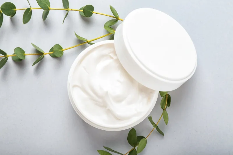 jar of cream on white background