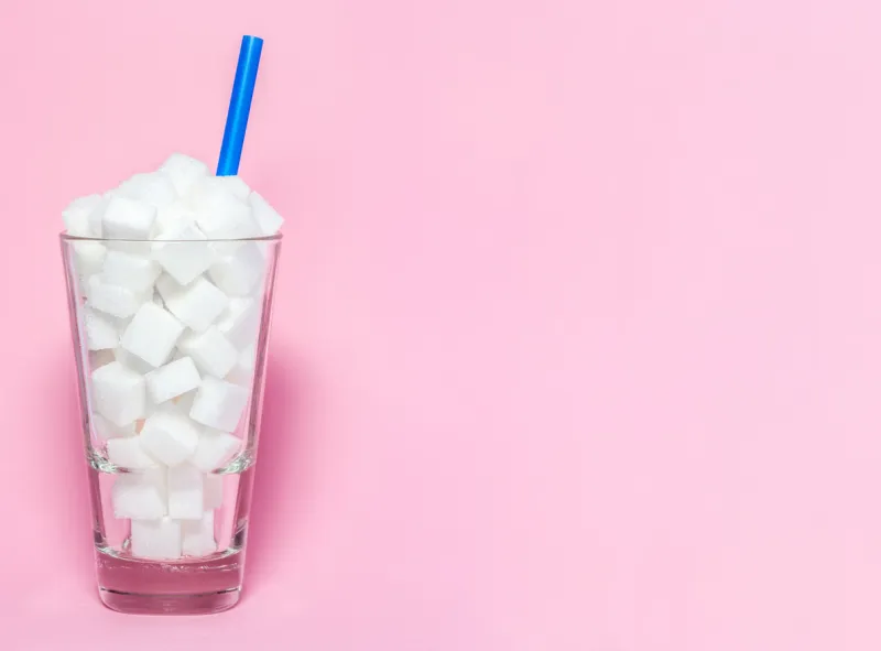glass full of sugar cubes - unhealthy diet concept