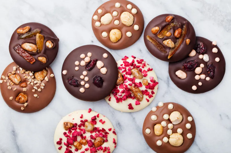 luxury handmade chocolate mediants, cookies, bites, candies traditional french christmas dessert copy space top view