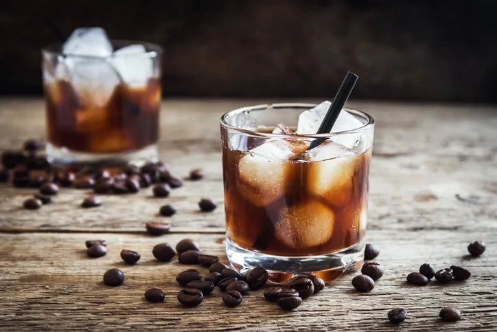 black russian cocktail with vodka and coffee liquor homemade alcoholic boozy black russian drink with coffee beans on wooden background with copy space