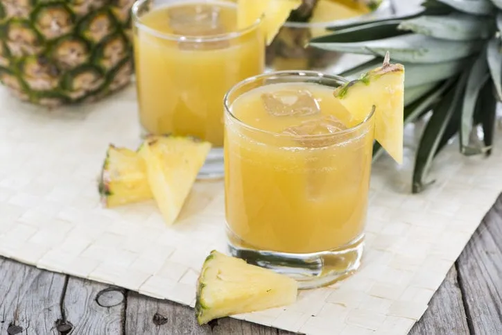 portion of fresh pineapple juice in a glass