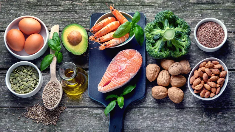 food sources of omega 3 and healthy fats foods high in fatty acids including seafood, vegetables, nut and seedsntop view