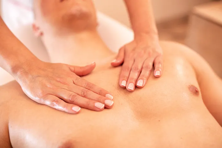 chest massage in close up, massage therapy with bare hands