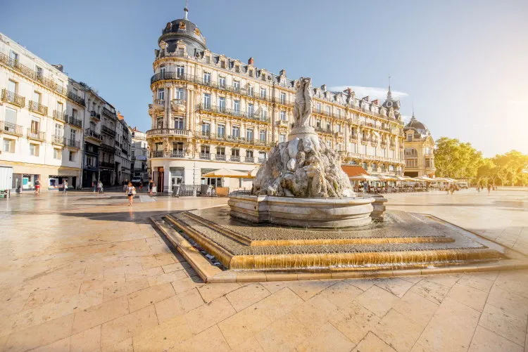 view on the comedy square with fountain of three graces during the morning light in montpellier city in southern france