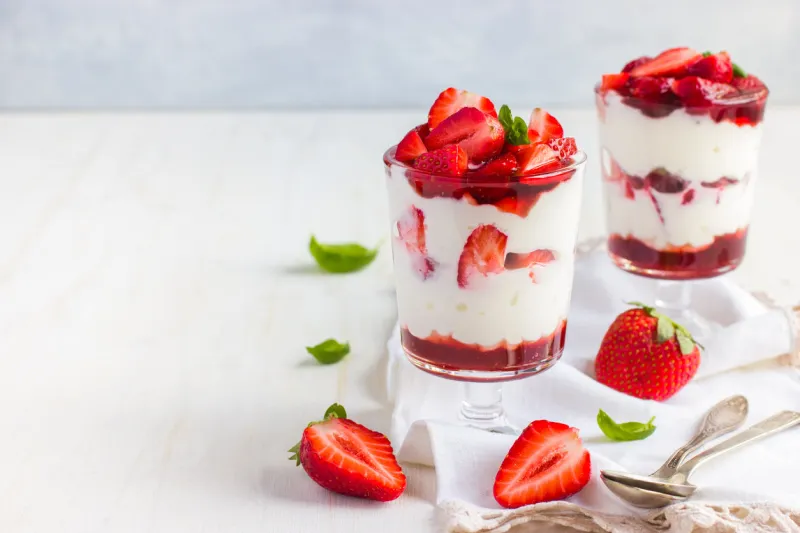 dessert with fresh strawberry, cream cheese and strawberry jam on glasses