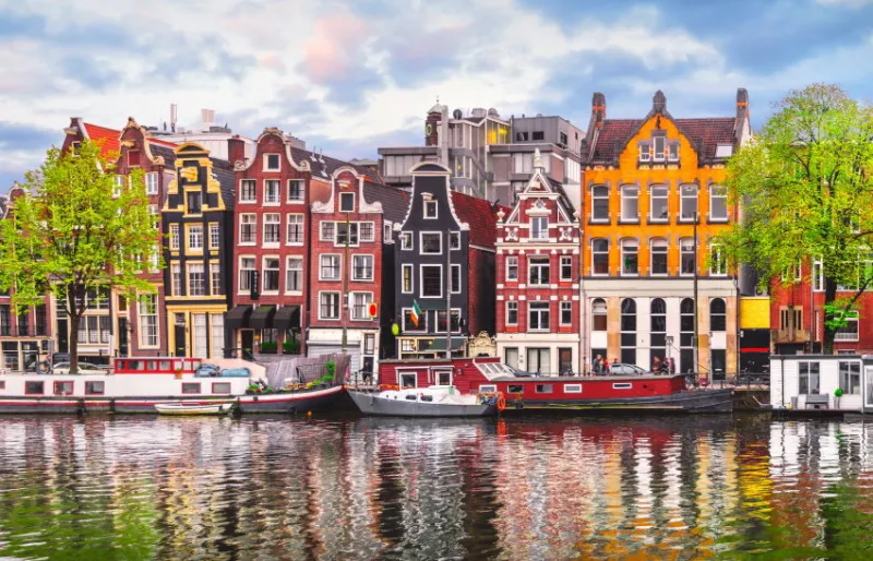 amsterdam netherlands dancing houses over river amstel landmark in old european city spring landscape