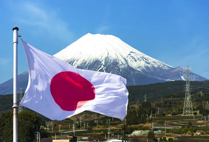japan, mount fuji on the island of honshu and japan flag