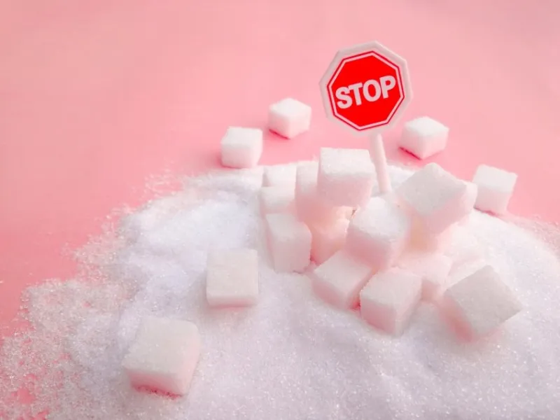 stop sign on the sugar, warned that the sugar too much will make unhealthy nutrition, obesity, diabetes, dental care and much more