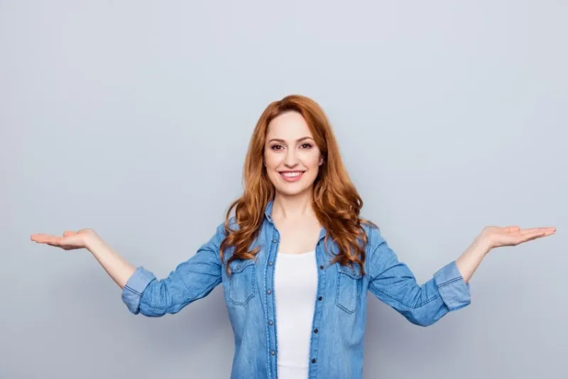 close up photo beautiful amazing she her model lady palms arms hands empty space novelty proposition pick select best option product wear casual blue jeans denim shirt isolated grey background