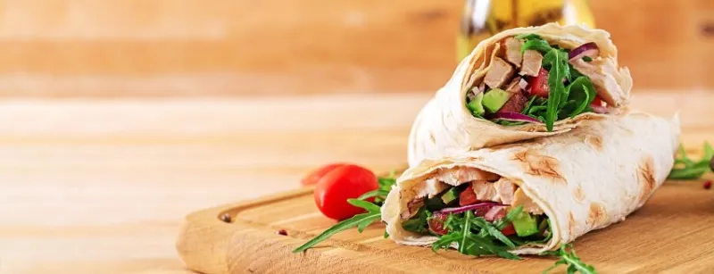 tortillas wraps with chicken and vegetables on wooden background chicken burrito banner healthy food