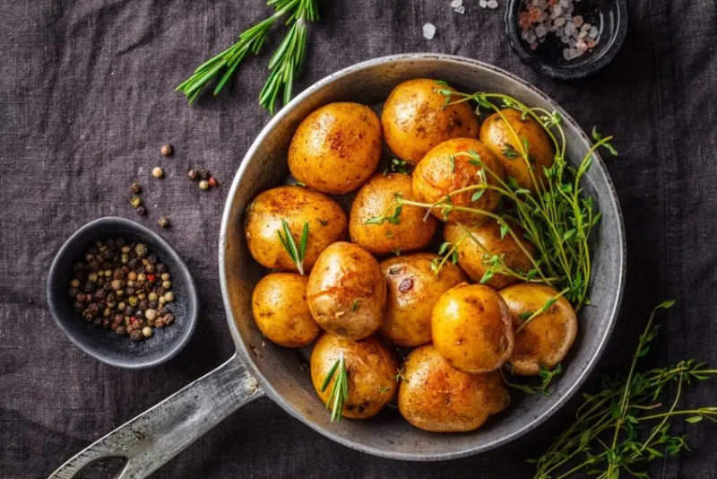 baked potatoes in a cast iron skillet, top view