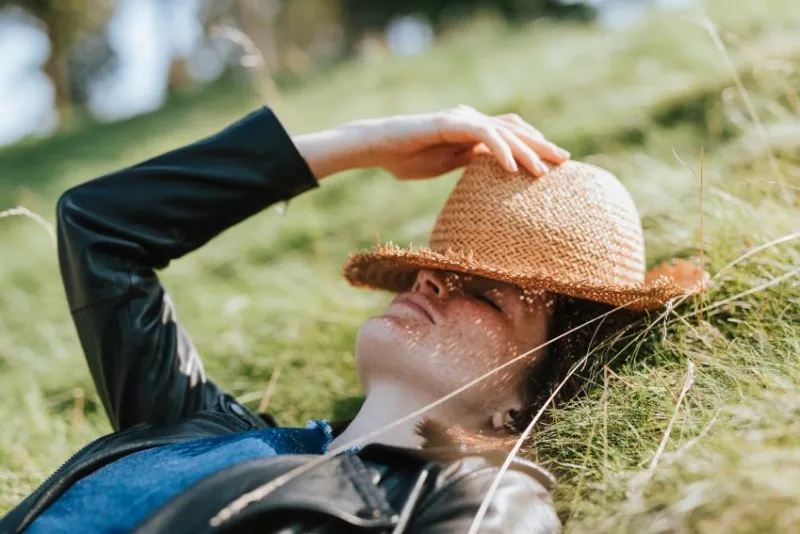 woman taking a nap on the grass