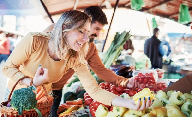 loving couple enjoying in shopping at street market lifestyle, consumerism, shopping