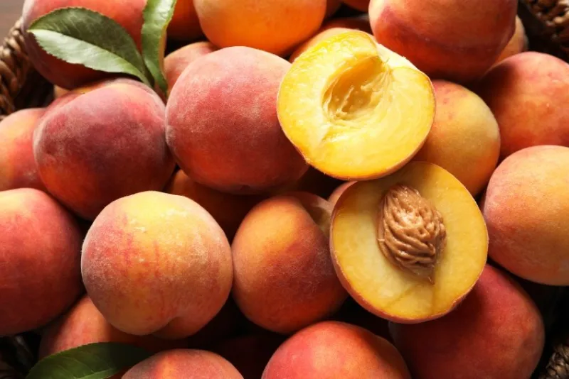 fresh sweet ripe peaches as background