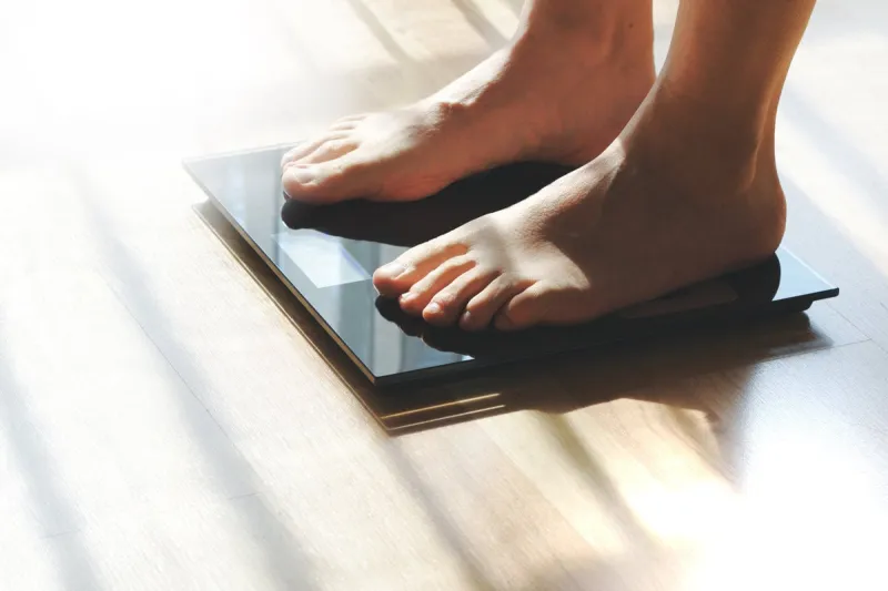 feet on a scale for weight control after bathroom empty copy sp