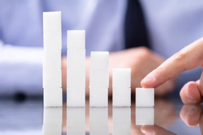 reduce sugar concept sugar cubes in declining chart