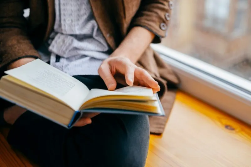 young man reading a book