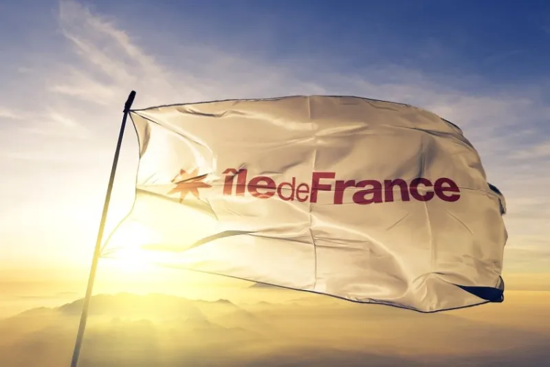 ile-de-france region of france flag textile cloth fabric waving on the top sunrise mist fog