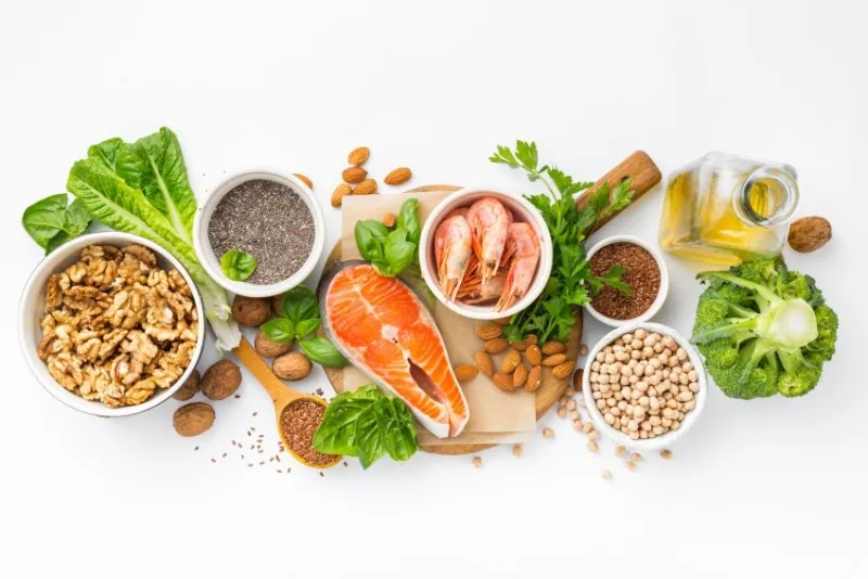 food sources of omega 3 and omega 6 on white background top view foods high in fatty acids including vegetables, seafood, nut and seeds