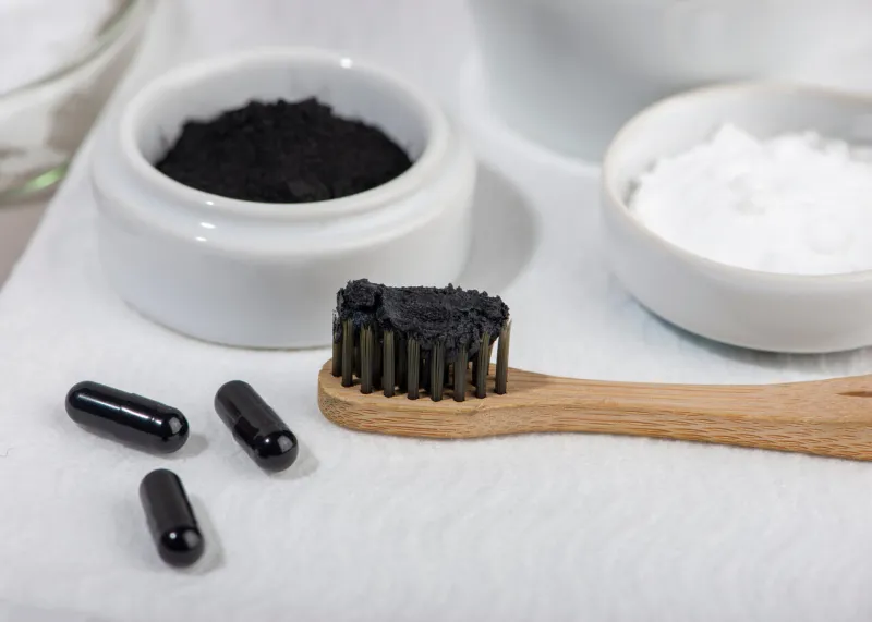 homemade charcoal powder toothpaste home beauty concept close up selective focus