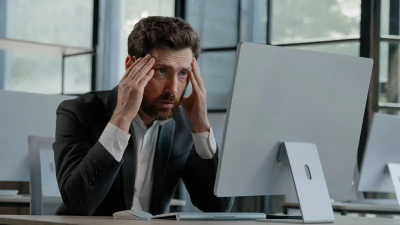 caucasian bearded 40s middle-aged businessman worker employee man typing laptop feel failure upset with lost of information online error stressed look at computer screen suffer from headache pressure high quality 4k footage