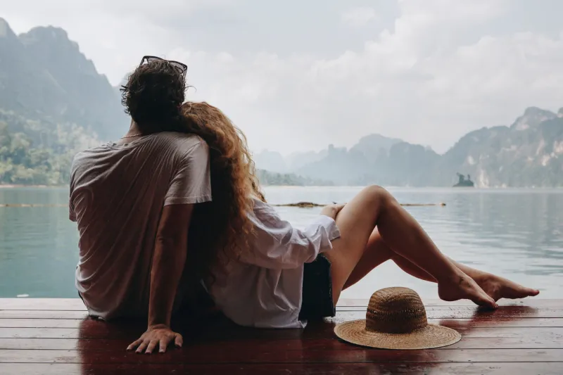 woman relaxing in her boyfriends lap