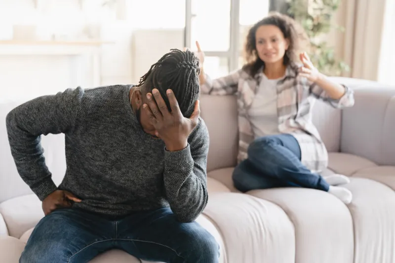 african-american wife crying arguing scolding at her husband at home misunderstanding between partners cheating, divorce, breakup abuse, gaslighting psychological therapy