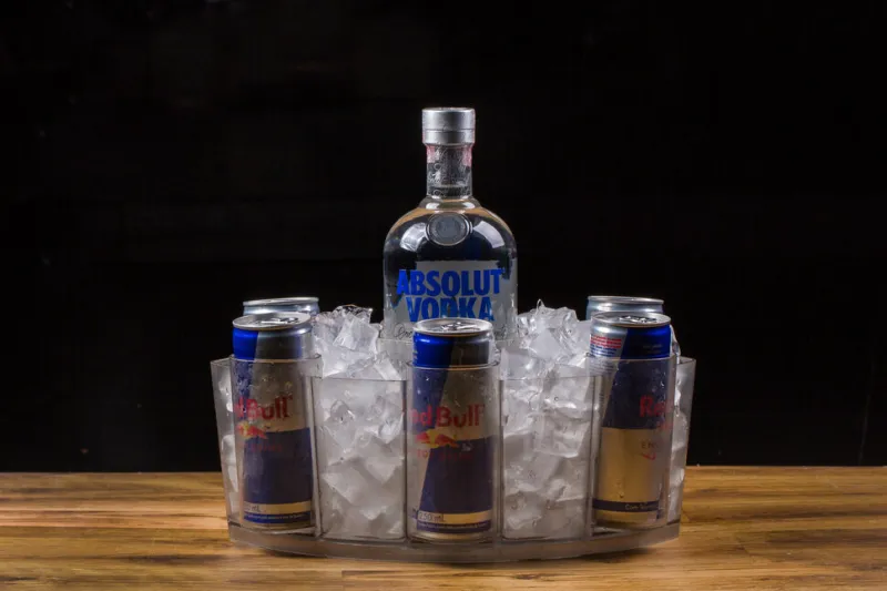 rio de janeiro, rj, brazil 07012022 combo with 1 bottle of absolut vodka and cans of red bull energy drink sugar free red bull is the most popular energy drink in the world kit sold in bar