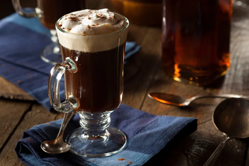 homemade irish coffee with whiskey and whipped cream