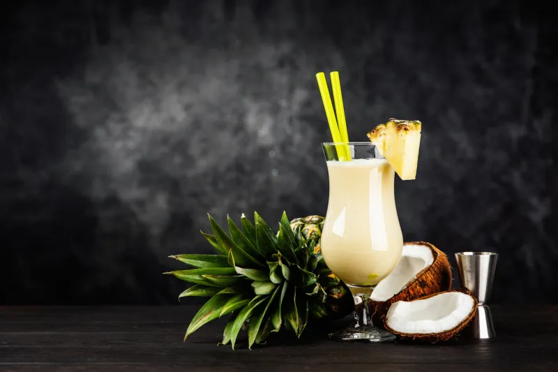 pina colada cocktail on dark background